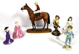 A small group of assorted ceramic figurines, including a Beswick model of Red Rum with jockey up and