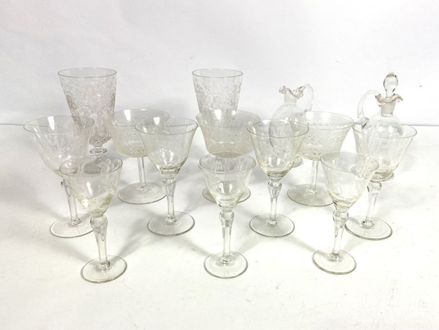 A collection of pretty cut glass wine glasses, including a pair of tapered goblets, cut with tree