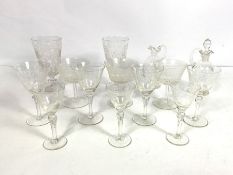 A collection of pretty cut glass wine glasses, including a pair of tapered goblets, cut with tree