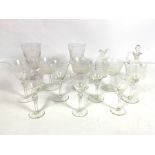 A collection of pretty cut glass wine glasses, including a pair of tapered goblets, cut with tree