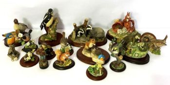 A mixed lot of Border Fine Art and related figures, including a woodpecker, otter, red squirrels,