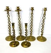 Three pairs of twist stem candlesticks, two pairs very tall 17th century style, one pair with a drip