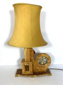 A modern decorative wood combined clock and lamp base, with burr maple and spalted wood segments,