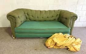 Vintage green chesterfield, button upholstered, with yellow loose cover