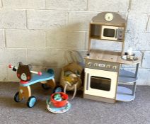 A miscellaneous group of vintage children's toys,  including a toy kitchen, with 'oven and sink' and
