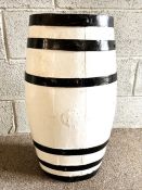 A white painted cask, with iron bands, re-purposed garden feature or planter