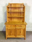 An Ercol ash dresser, with gallery back and two drawers and two cabinet doors, 183cm high, 107cm