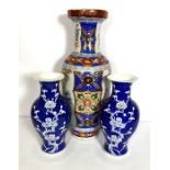 A pair of Chinese porcelain blue and white baluster vases, modern, decorated with prunus, 36cm high;