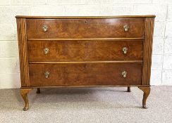 An Art Deco oak and walnut veneered bedroom commode or chest, with three long drawers and squat