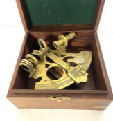 A cased brass sextant, unsigned; together with a vintage brass perpetual desk calendar, of