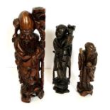 Three Asian root carvings of standing figures, including a metal inlaid philosopher (3)