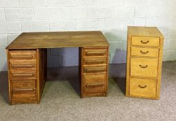 A vintage oak kneehole desk, with plain top over eight drawers, 127cm wide, together with a filing