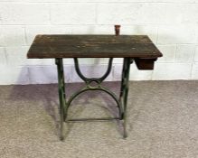 A vintage sewing machine table, converted as a small workbench; and a LLoyd Loom style linen