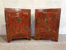An attractive pair of Chinese red lacquered cabinets, 20th century, each with gilt figures within. a