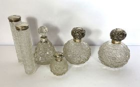 A pair of Edwardian silver topped dressing table bottles, hallmarked Birmingham 1907; together