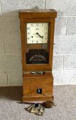 A National Time Recorder 'clocking in' machine, with a square dial, signed National, with a