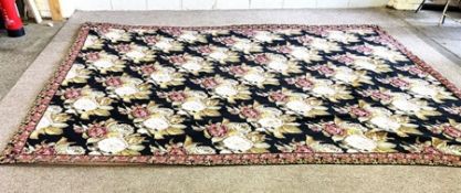A large needlepoint carpet, 20th century, in manner of Colefax & Fowler, decorated with roses on a