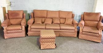 A Peter Guild three piece suite, including a three seat sofa, two armchairs and a matching pouffe,