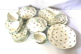 A Shelley bone china 'Rosebud' part dinner service, with two covered tureens and assorted plates and
