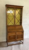 A vintage oak bureau bookcase, with glazed top and fall front
