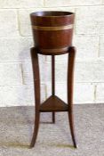 A vintage plant stand, with ring bound planter and tripod base; together with a clothes stand (2)