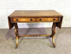 A reproduction Regency mahogany veneered sofa table, with drop leaf top and lyre supports, 73cm