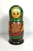 An unusually large vintage Russian Matryoshka doll, with fifty nested graduated dolls, inscribed