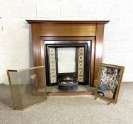 A late Victorian chimneypiece, including a mantel, cast iron centre and grate, set with later