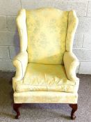 Wing armchair, with cream upholstery