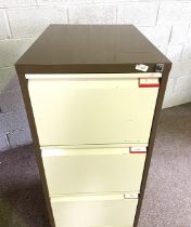A modern metal three drawer filing cabinet, with key