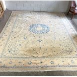 A large modern carpet, with medallion on a cream ground, 450cm long by 340cm wide