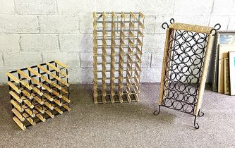 Three assorted wine racks, including a decorative 24 bottle stand, with circular apertures (3)