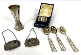 A silver napkin ring, cased; together with two silver spirit labels for brandy & whisky; also a