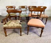 A set of six Victorian mahogany rounded bar back dining chairs, with padded seats and turned front