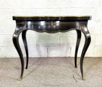 A late Regency ebony and gilt brass inlaid card table, early 19th century, with serpentine fold over