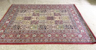 A modern decorative Caucasian style rug, with divided rectangular sectioned field, and red