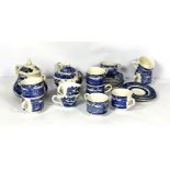 A mixed selection of china cups, including a blue and white transfer printed tea set, assorted