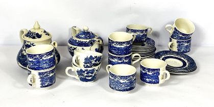 A mixed selection of china cups, including a blue and white transfer printed tea set, assorted