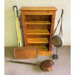 Assorted items, including a pine open bookcase; also a Victorian warming pan, umbrellas and other