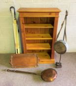 Assorted items, including a pine open bookcase; also a Victorian warming pan, umbrellas and other