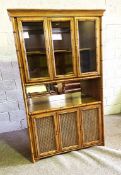 A large modern dresser/display cabinet, circa 2000, Colonial style, with faux bamboo moulding, the