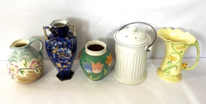 A small group of colourful vases and lamp bases, including a decorative jug with stylized flower