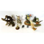 A group of assorted figurines, including a stoat, blue tit and two parrots (a lot)