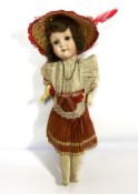 A German bisque socket head doll, early 20th century, with articulated eyes, inscribed to back of