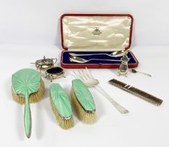 A small group of silver items, including a silver a green enamel backed three brush set; a silver