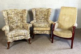 Two wing armchairs, and a modern armchair, with padded arm rests (3)