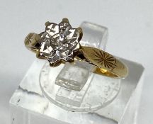 A diamond and 18 carat gold ring, with 1/16th carat diamond set in star setting with 18 carat