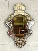 An Italian style Baroque wall mirror, early 20th century, with multiple mirrored border plates,