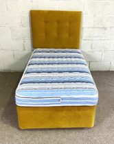 A single bed, with mustard upholstered padded headboard and matching divan; together with a