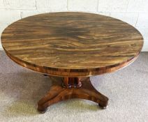 A George IV rosewood breakfast table, circa 1825, with a circular tilt top with strongly grained